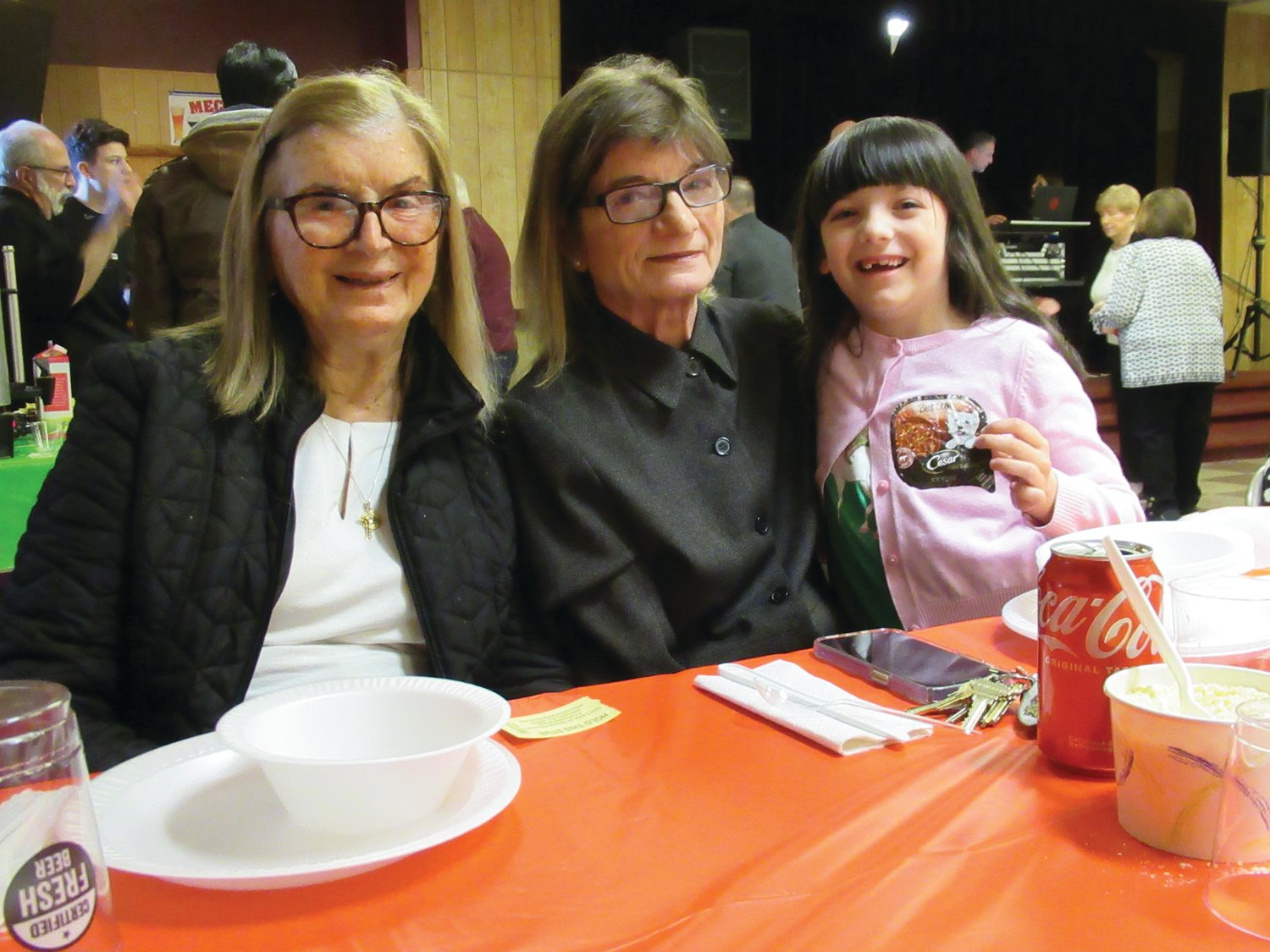 FAMILY FEAST: Marysue Andreozzi, member of the Johnston School Committee and Vilma Zanni brought Maryrose Andreozzi to Saturday’s annual OLG St. Joseph’s Table event.